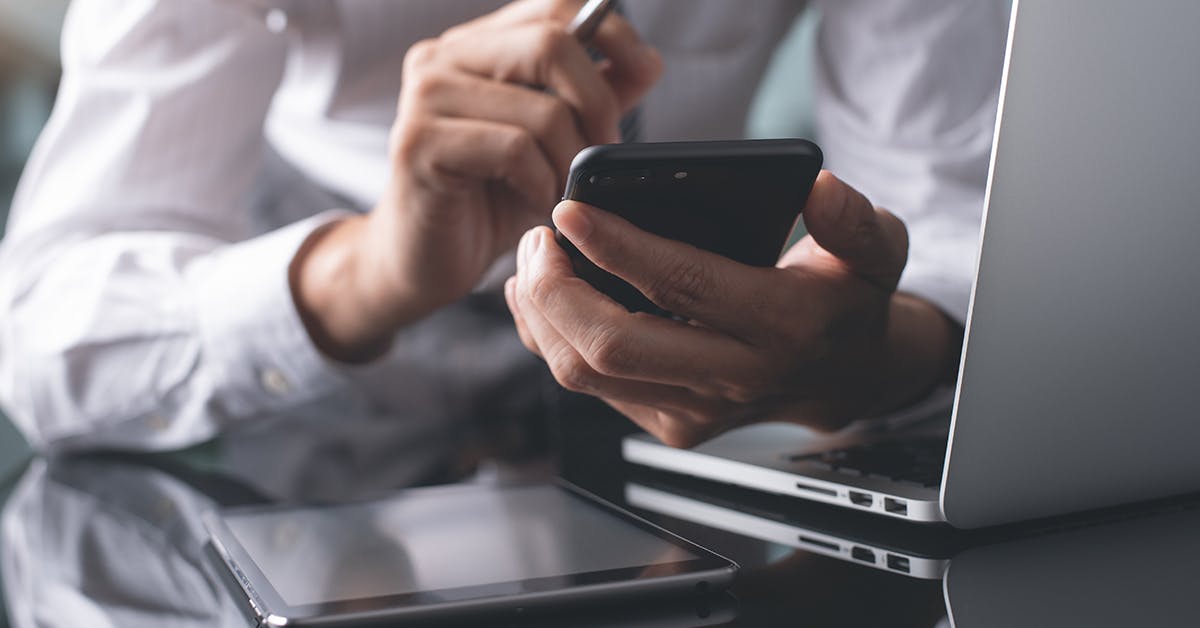 Photo of man with devices -Laptop,Tablet, Phone