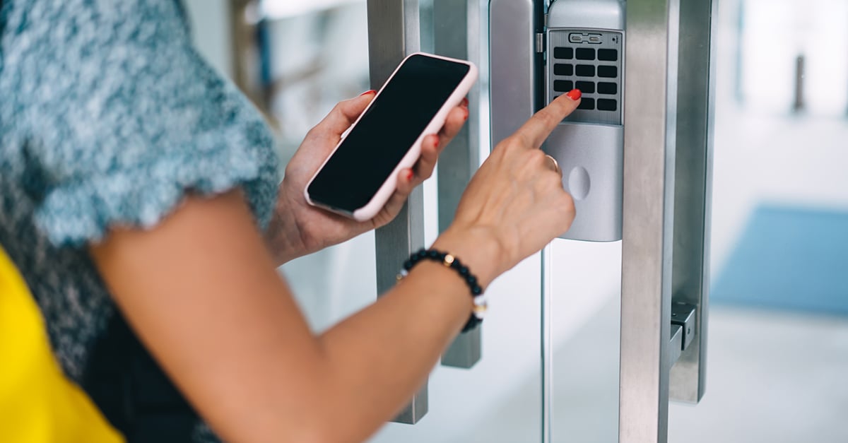 person accessing a room using a keypad. 