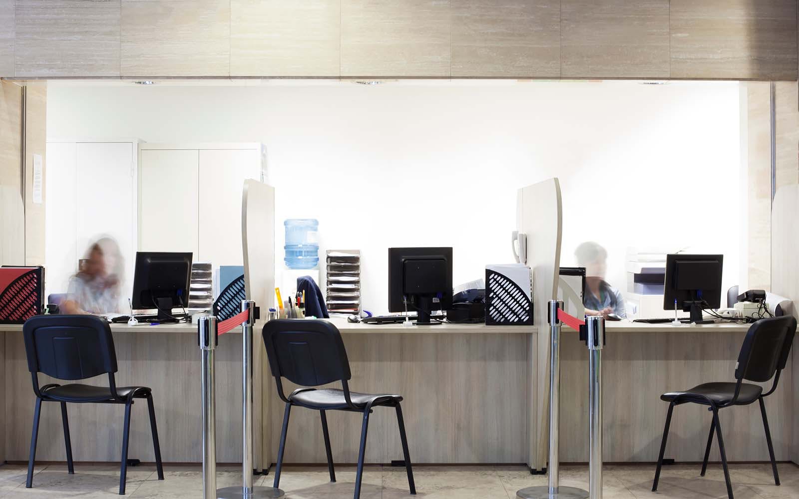 A row of desks at a financial institution